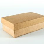 brown cardboard box on white surface