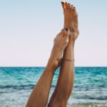 person wearing silver bracelet and bracelet